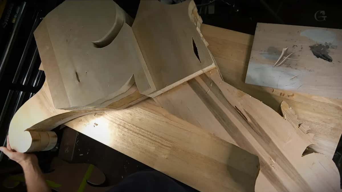 Forty two inches One hand at the rolled scroll end of the blank, the rest of it running away down the bench