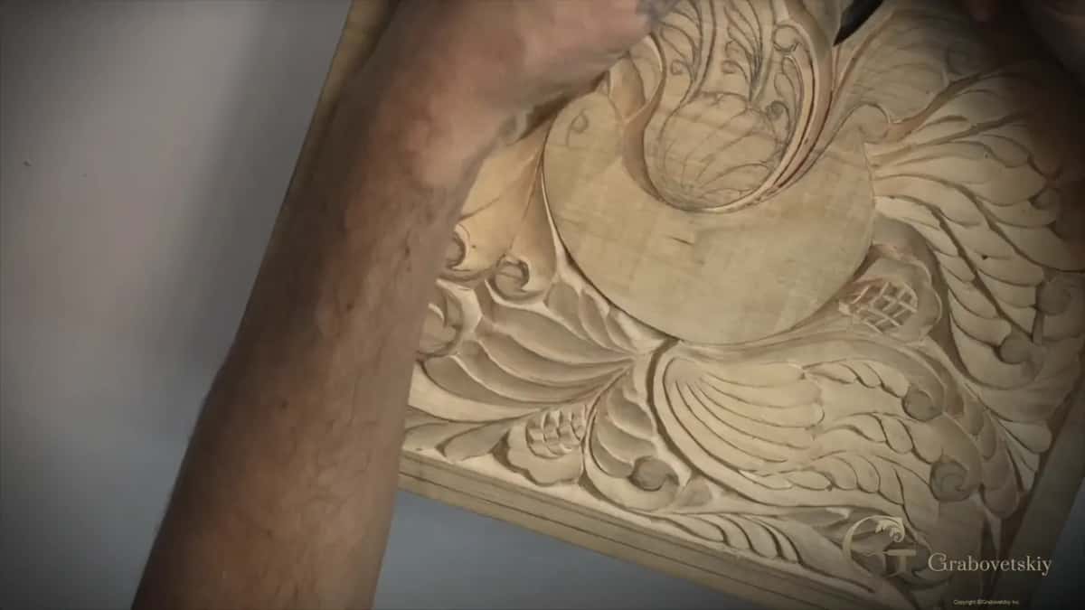 Carving out to the edge of the detail until the last of the red mark disappears.