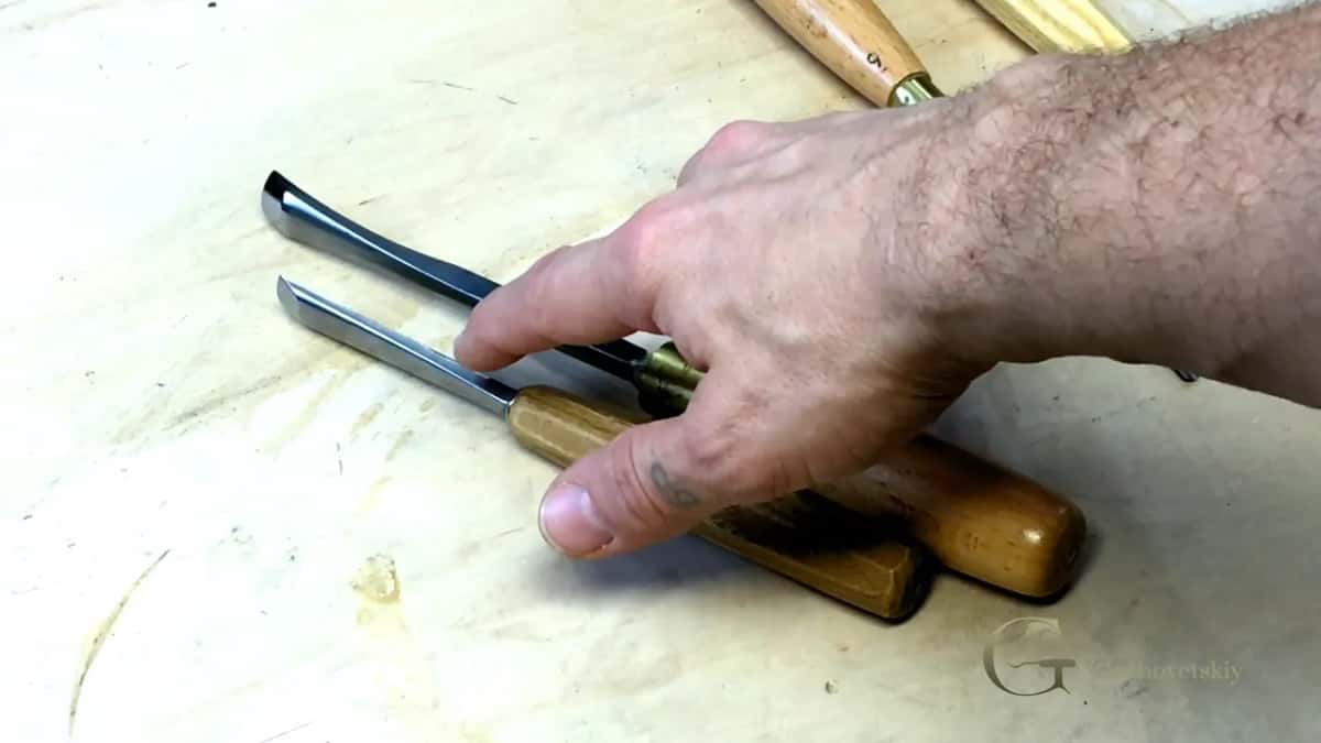 Two gouges overlap, one blade thicker.
