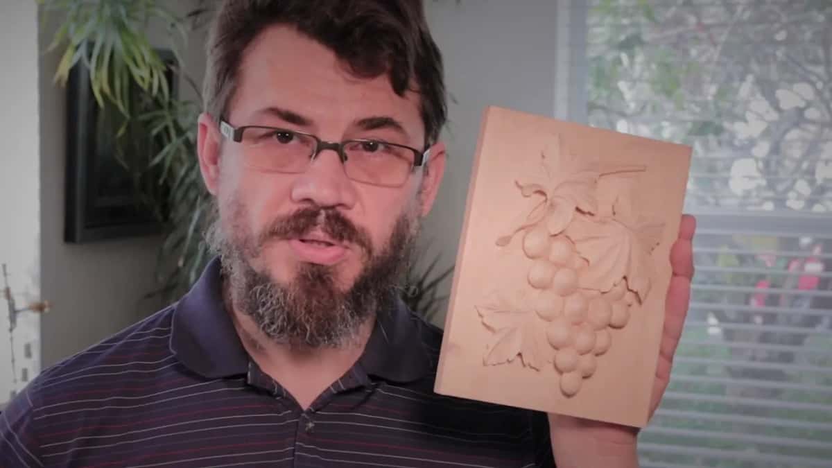 Finished grape panel on a small basswood block, its leaves and fruit standing out in full round relief.