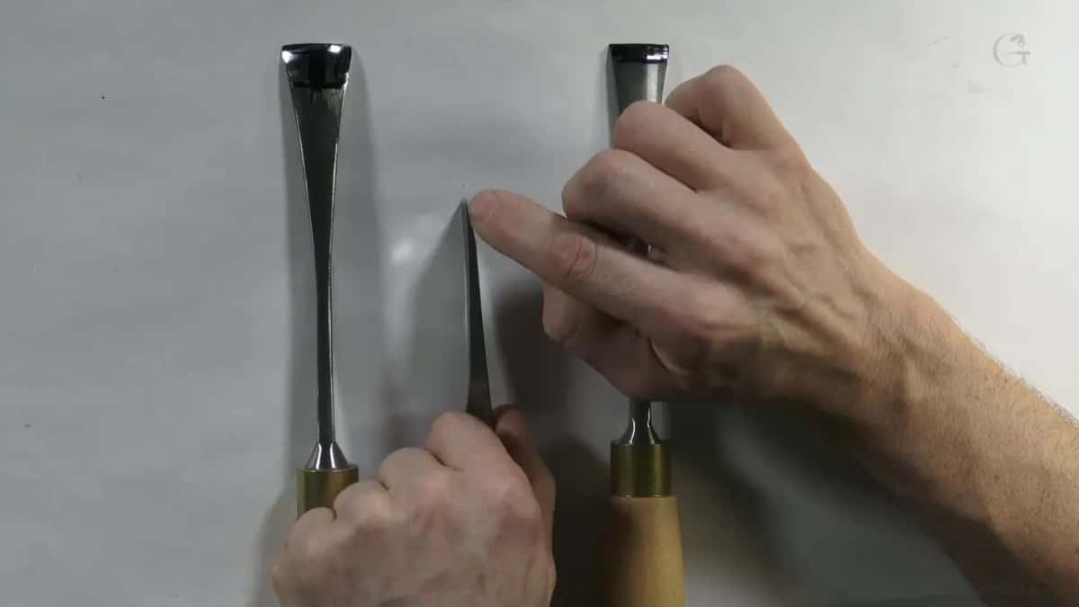 Two gouges close up, where a long grind thins the metal.
