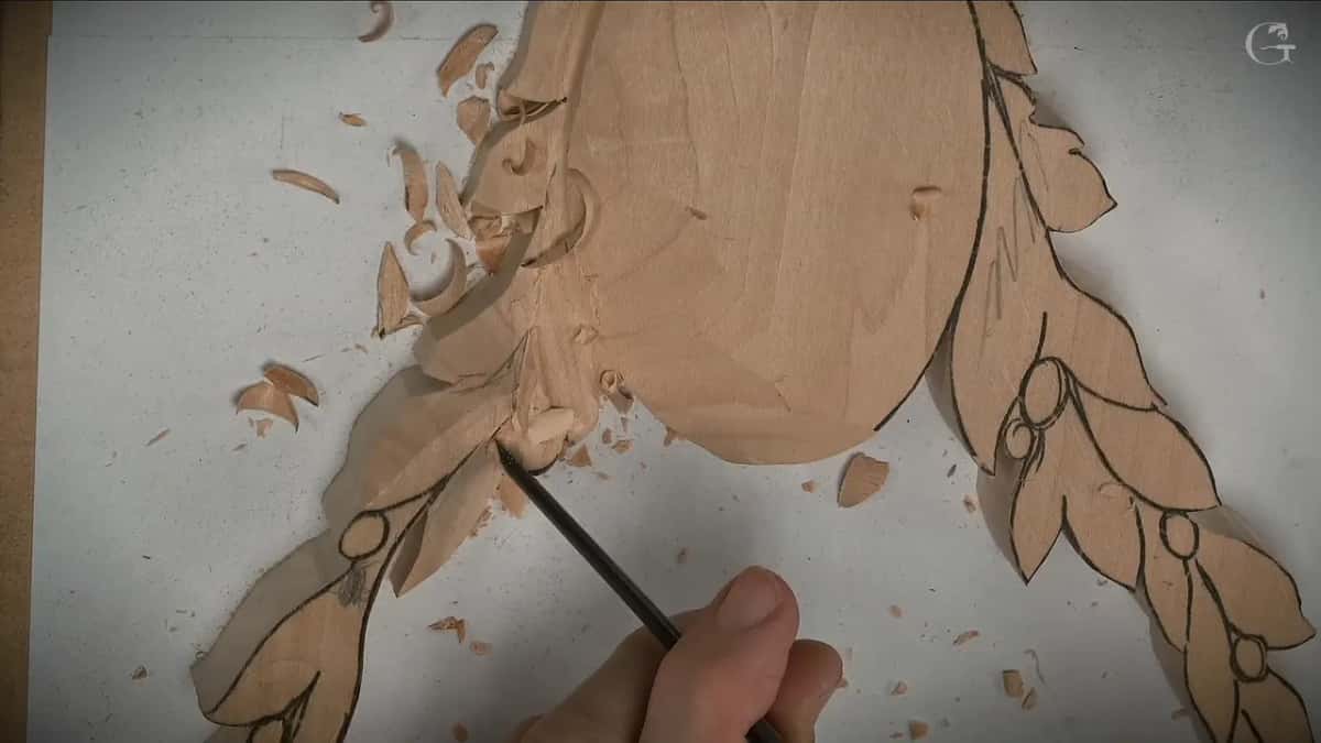 A narrow tool points at a small rounded berry just below the oval, the right spray still drawn