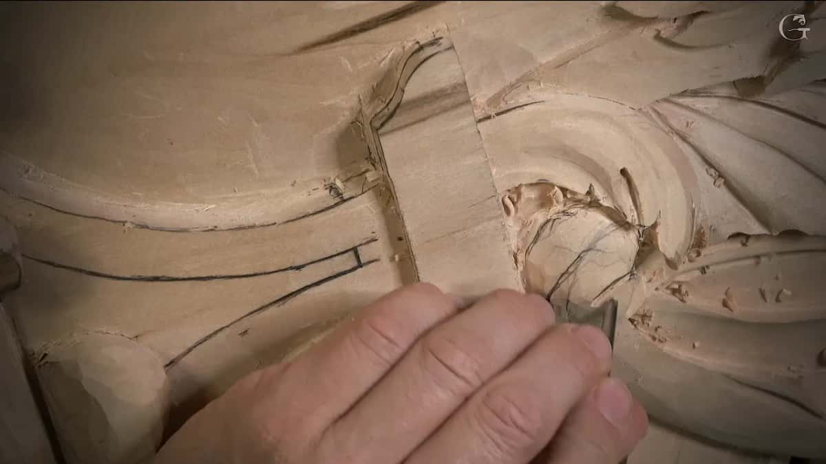 Fingers steady a small tool