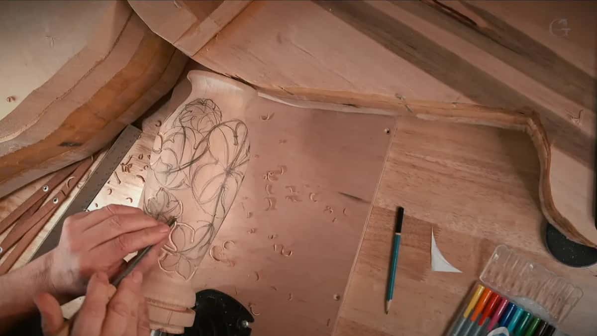 Small gouge tracing the pencil outline on the bare vase