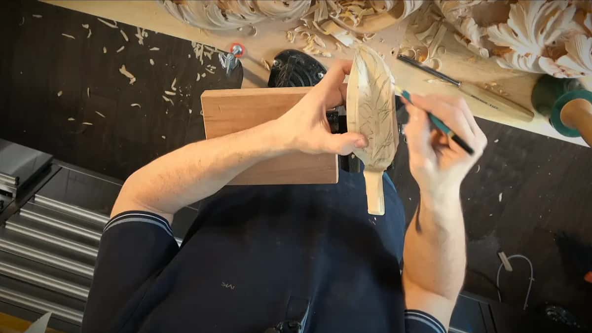 From above, a small carved leaf gets pencil lines