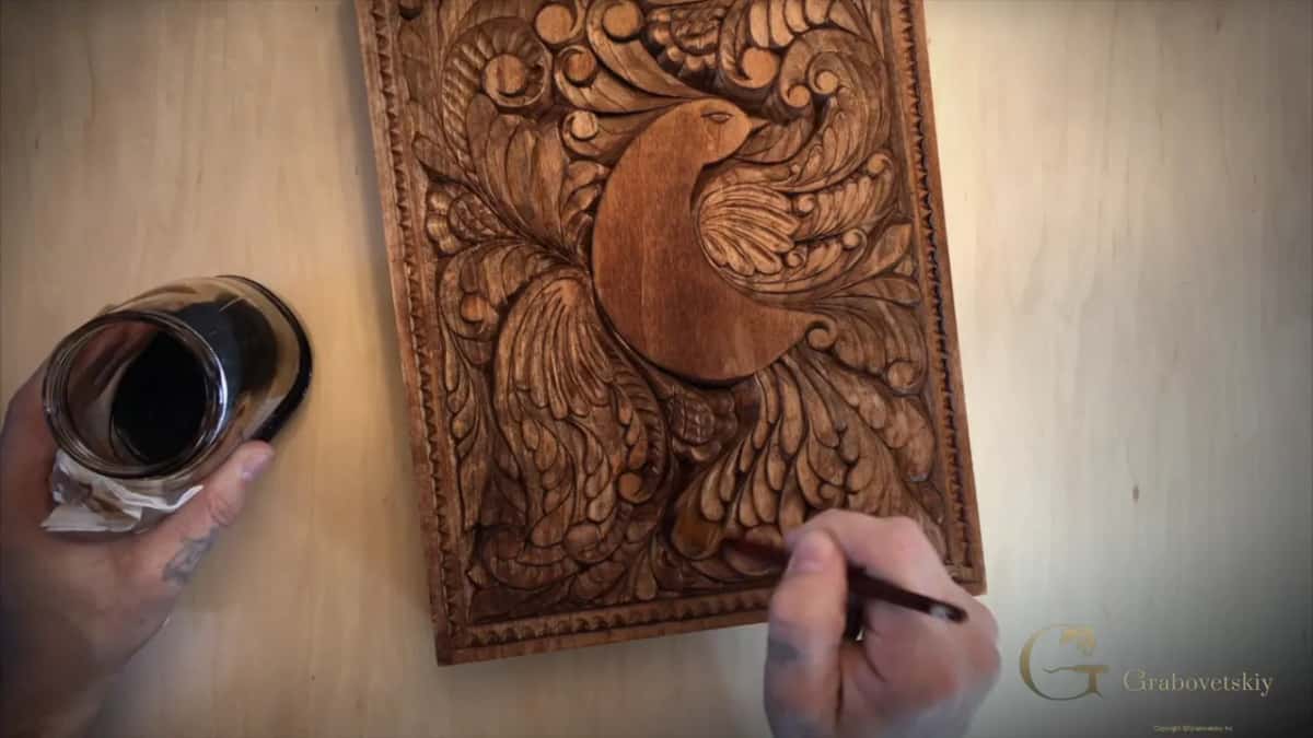 Fully brown panel, a thin brush low at the right edge