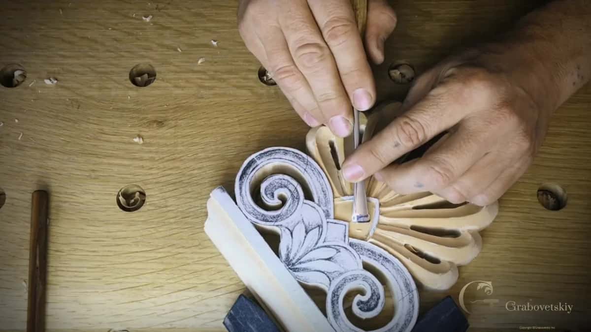 Narrow gouge set into the center, where the carved fan meets the papered swirls