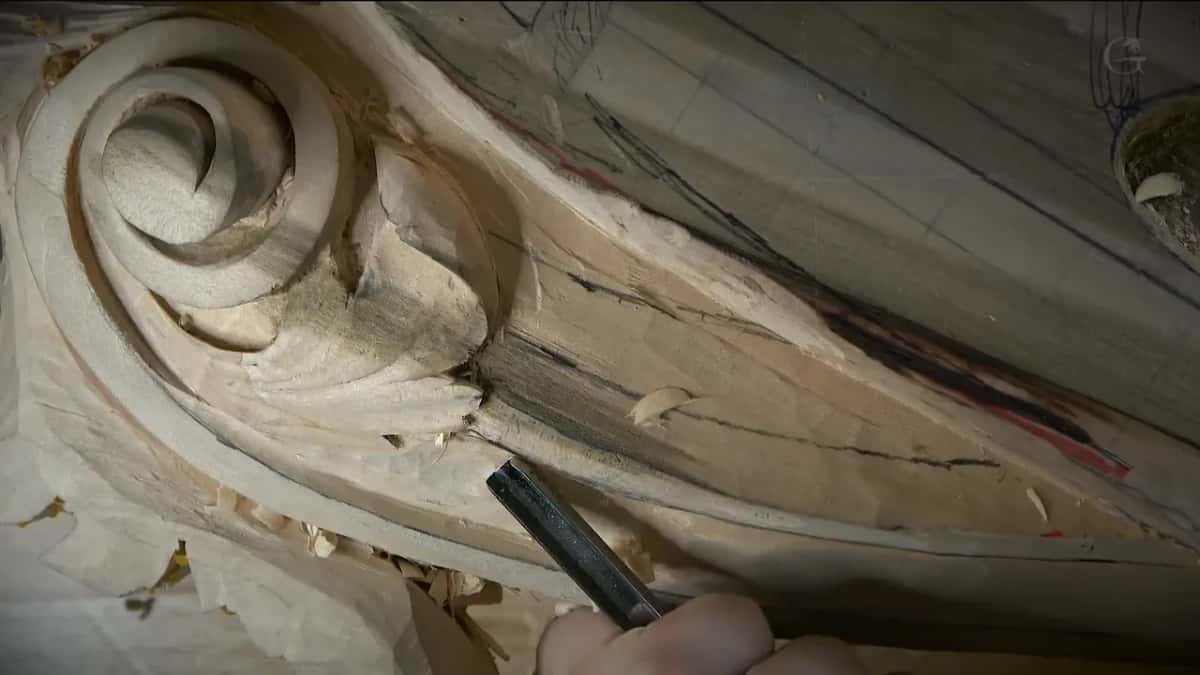 A finished spiral volute, a gouge slipping into the groove that runs below it