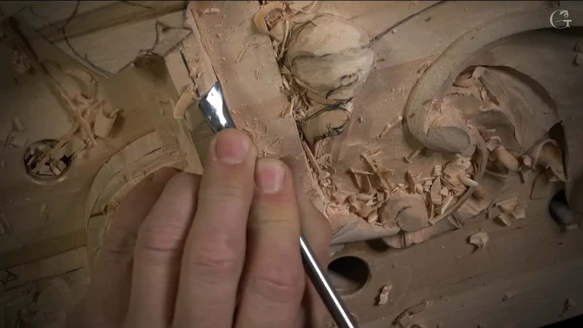 A bent gouge stands nearly upright at the corner where the convex begins