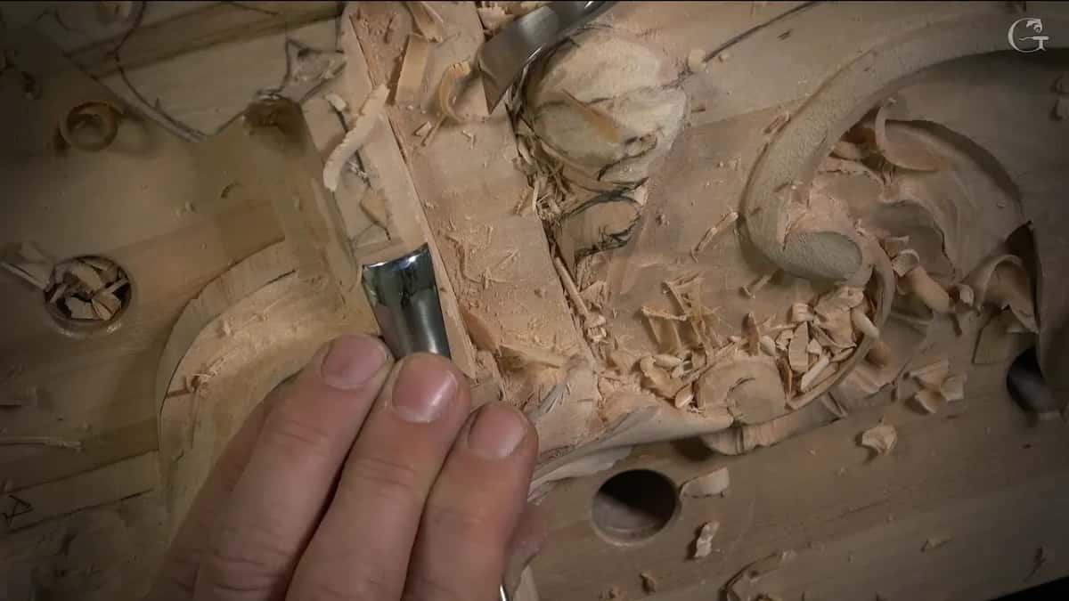 Two bent tools at once, one near the top while the other sits in the corner of the convex