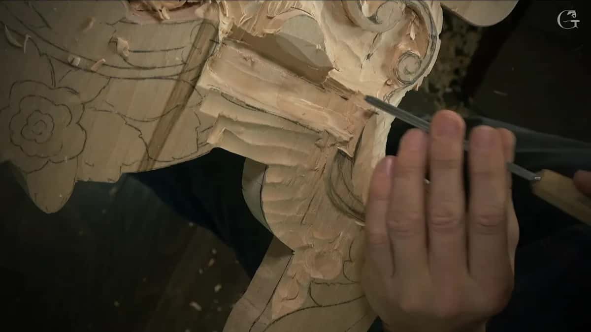 Narrow gouge running beside the lowered strip, the pencil rose drawn on the flat next to it