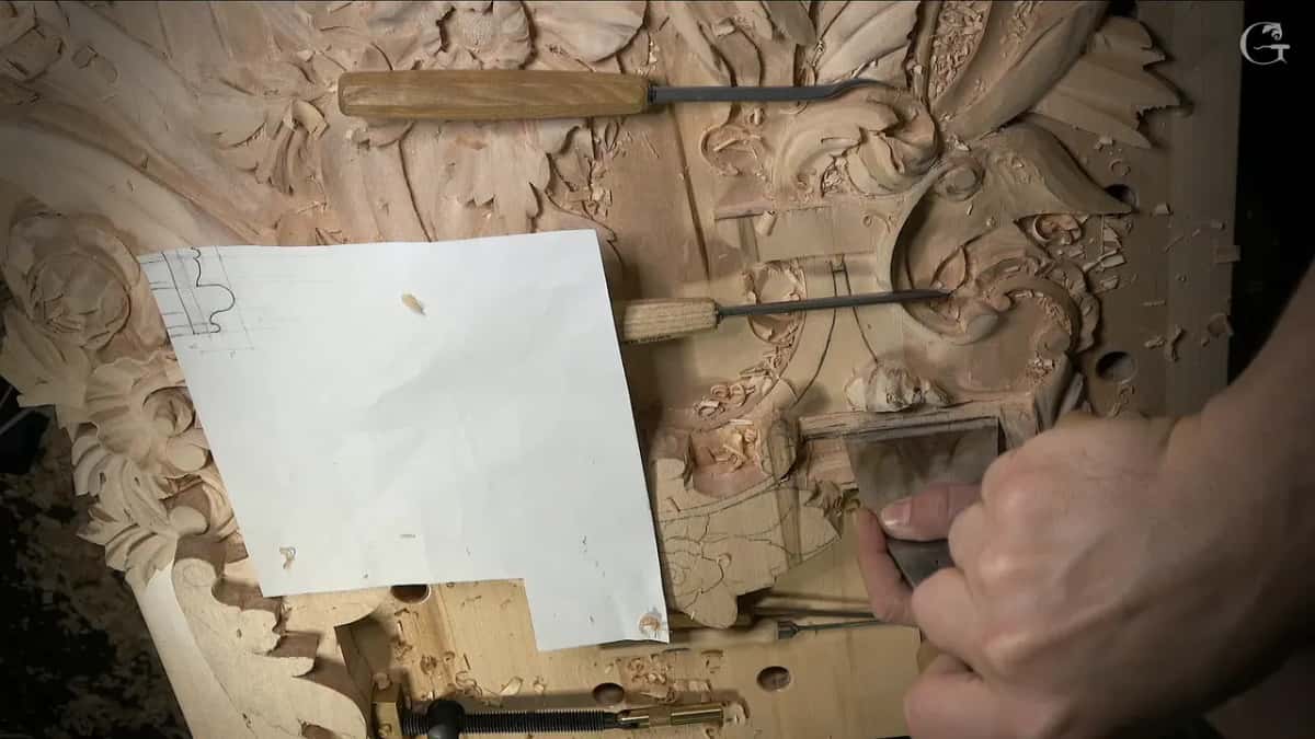 Wide flat blade gripped in a fist, standing on the molding