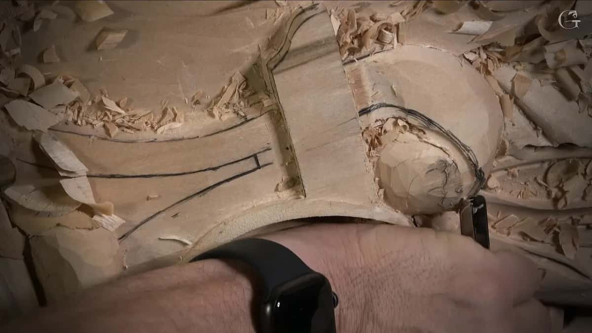 Wrist over a round shape, its drawn lines still showing