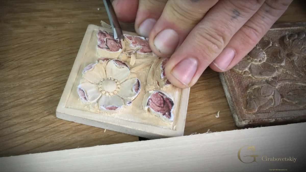 Small gouge working around the flowers at the top