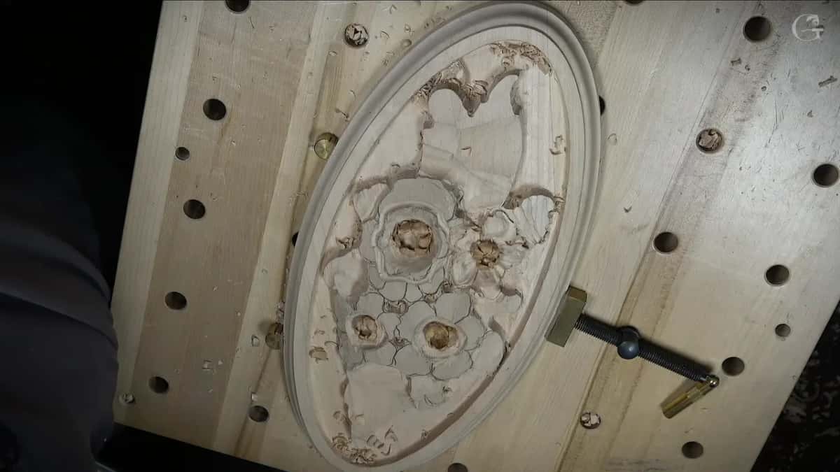 Half-carved oval panel seen from above