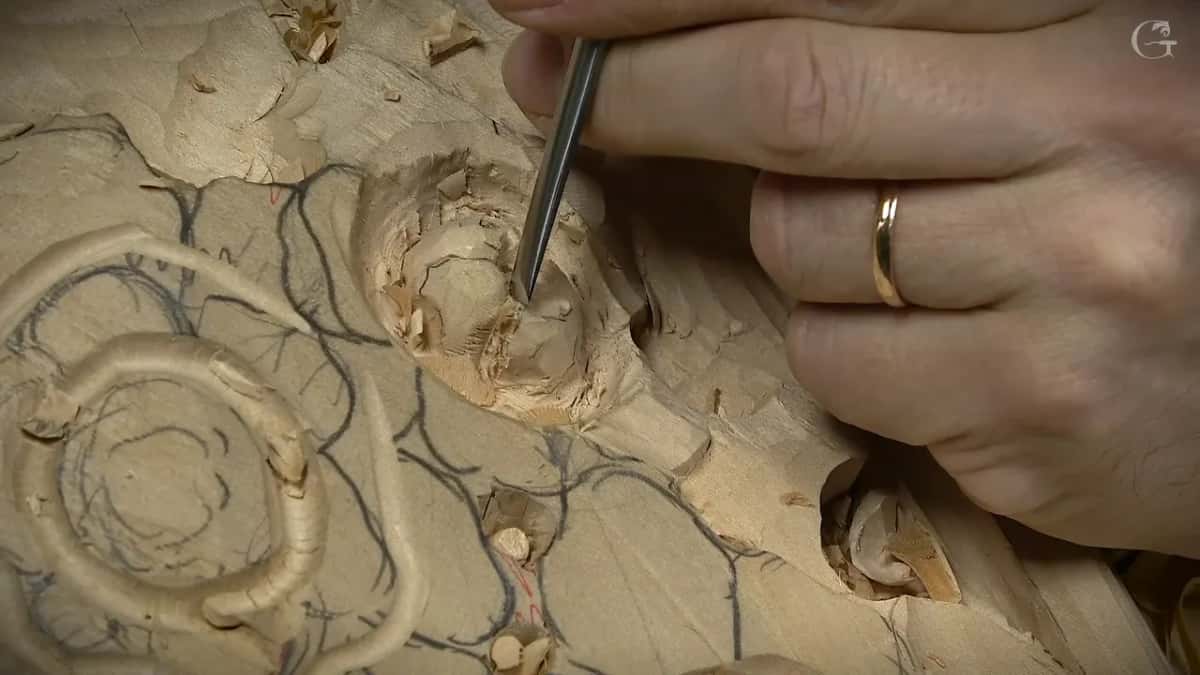 Narrow gouge dug into a button flower, pencil lines around it
