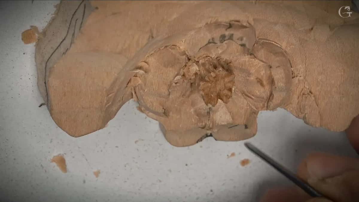 Thin tool at the lower right of the roughed flower