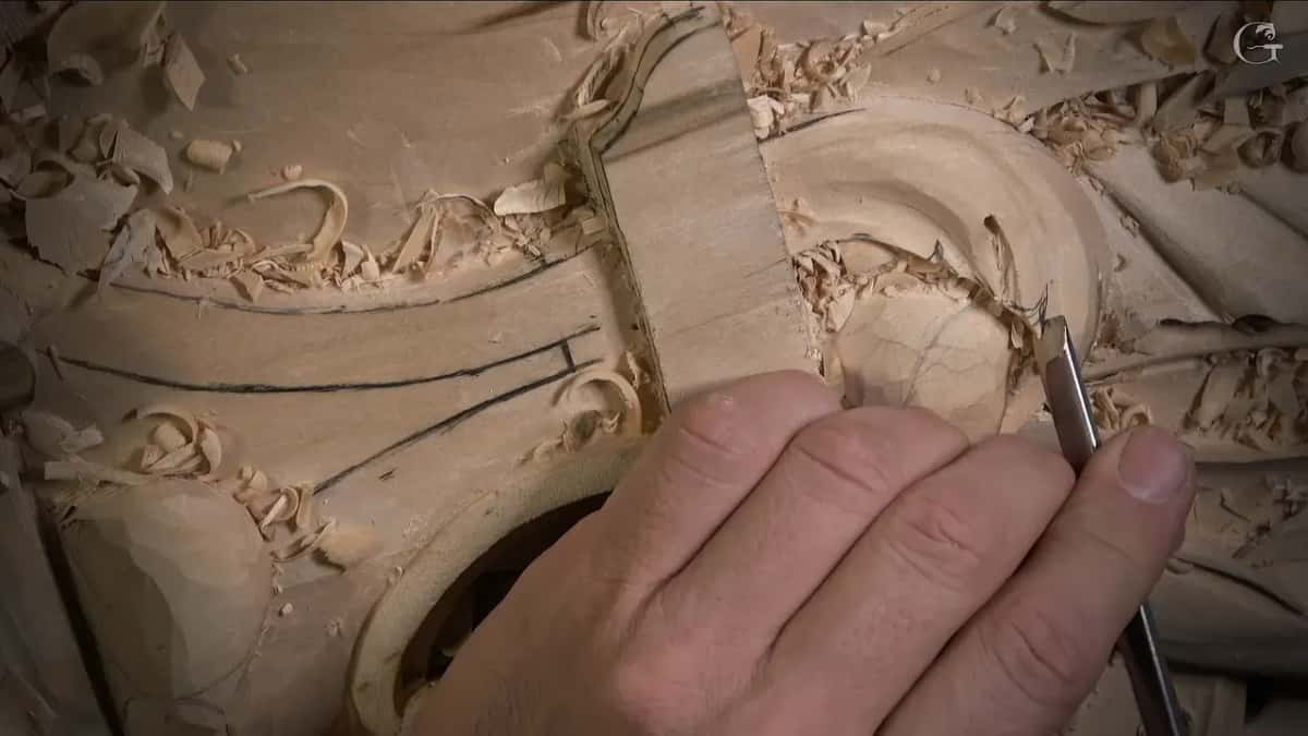 Narrow gouge between the fingers, close to the round hollow, chips everywhere