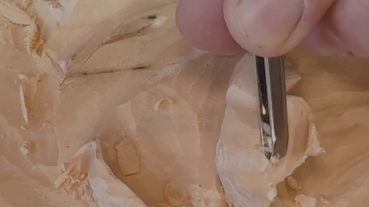 Seen up close, a gouge edge takes a tiny pass in pale wood