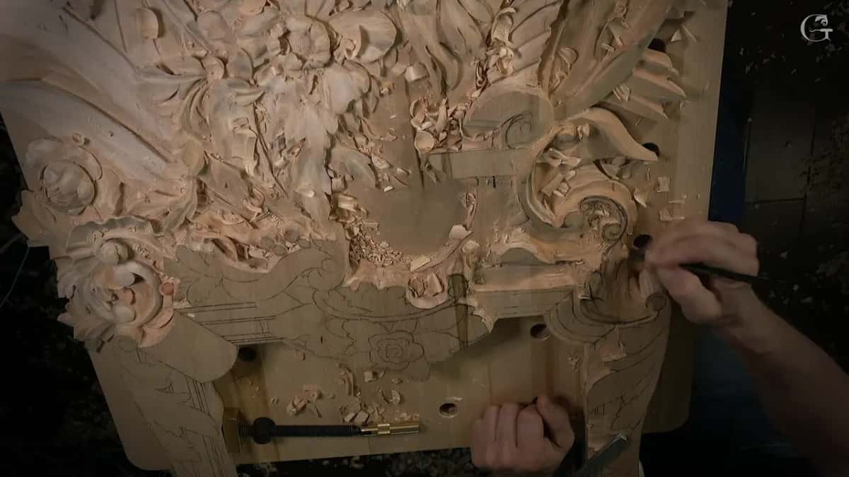 Two hands at the right edge of the panel