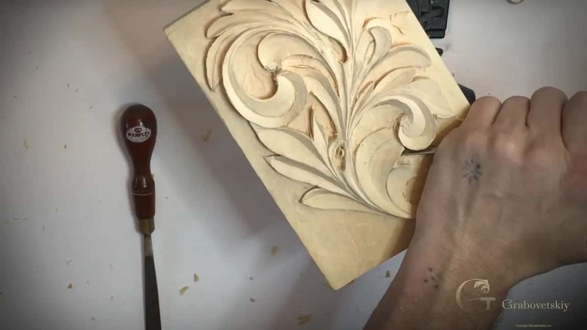 Working a curl of the Greek leaf