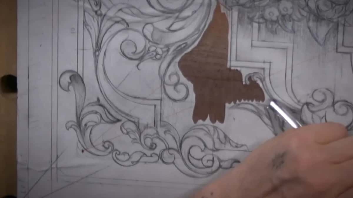 One patch of the paper is gone and dark walnut shows where the background came out.