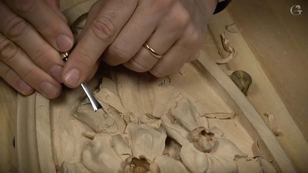 Both hands on a small bent tool