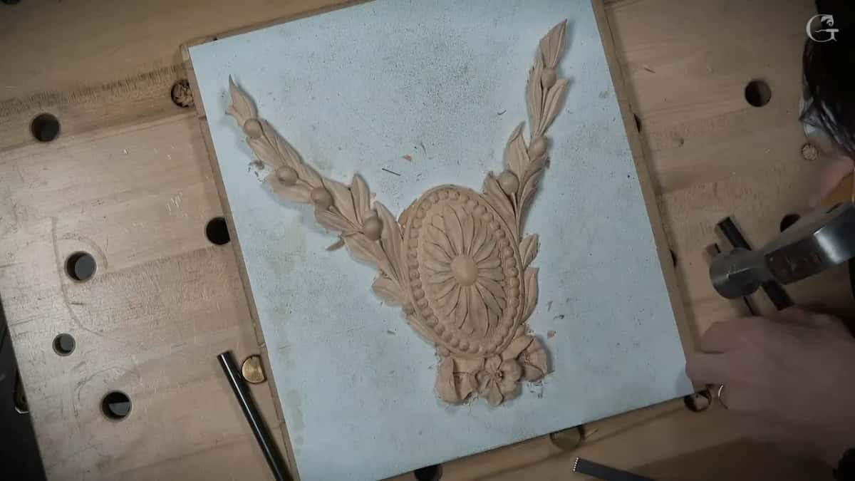 Hammer and punch at work on the right of the board